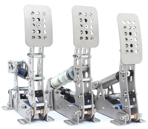 Three Metal Pedals Sitting On Top Of Each Other