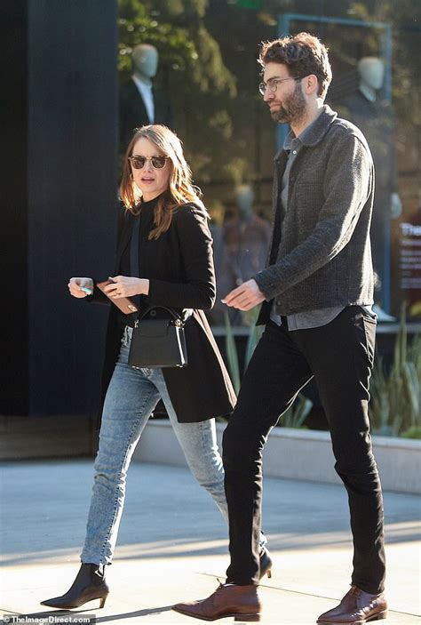 Emma Stone s fiancé Dave McCary beams as they stroll arm in arm Emma
