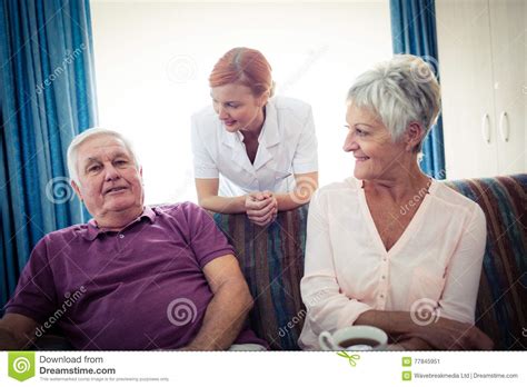 Seniors Interacting With Nurse Stock Image Image Of Geriatric