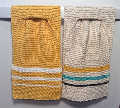 Two Knitted Towels Hanging On The Wall