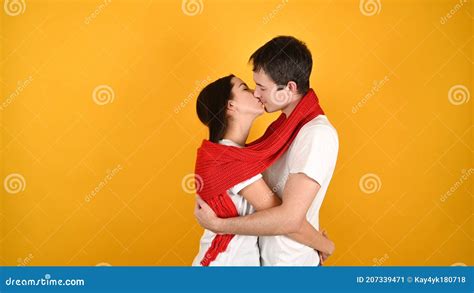 Kissing Young Couple On A Yellow Background Stock Image Image Of Human Indoor 207339471