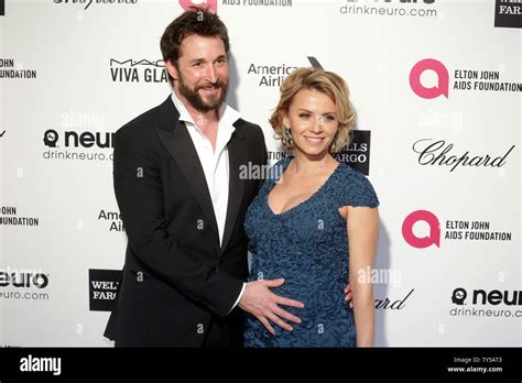 Noah Wyle And Sara Wells Arrives For The Elton John Aids Foundation Academy Awards Viewing Party