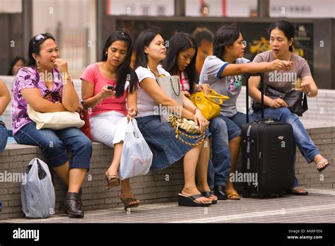 Hong Kong China Domestic Workers Nannies From The Philippines Enjoy Socializing On Their One Day