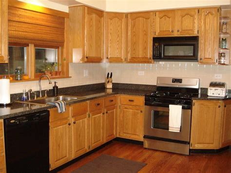 First, the oak cabinets have a light stain and the countertops are white granite. Kitchen Paint Colors Honey Oak Cabinets Appliance - Decoratorist - #81175