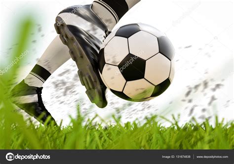 Futbolista pateando pelota de fútbol en movimiento Foto de stock phonlamai