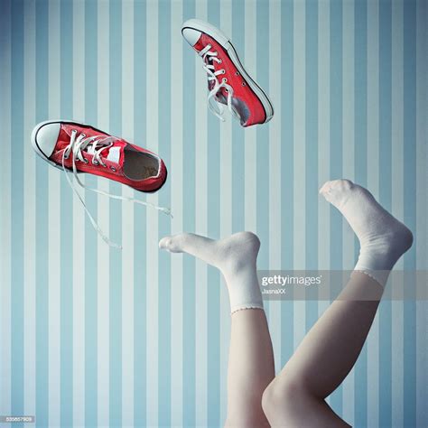 Woman With Her Legs In The Air With Trainers Mid Air Photo Getty Images