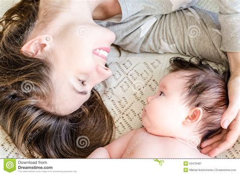 Portrait Of Happy Beautiful Mother And Cute Newborn Baby Girl Stock