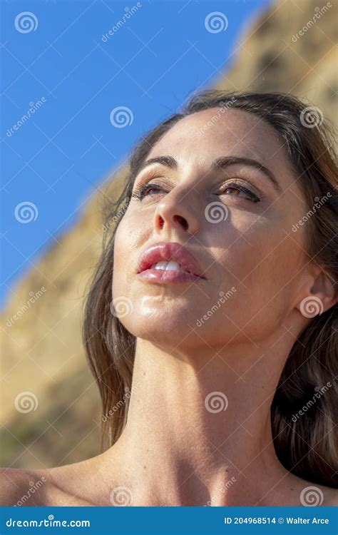 Lovely Brunette Bikini Model Relaxing On The Beach Stock Photo Image