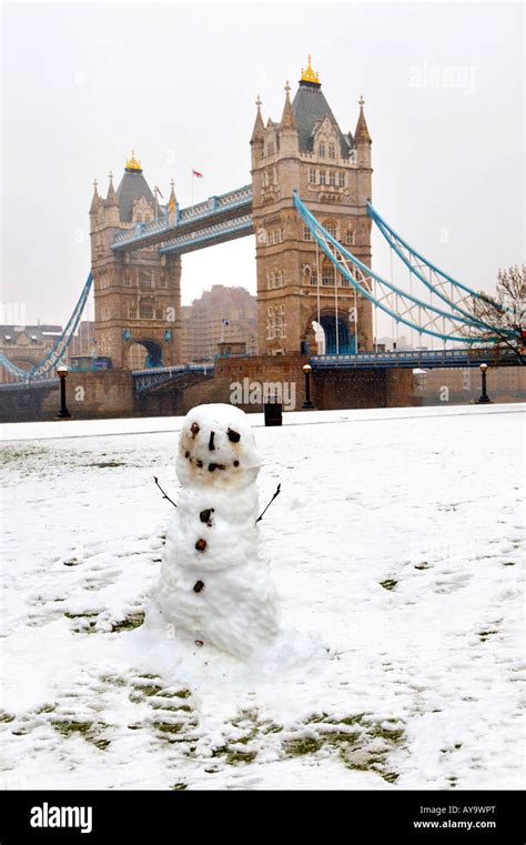 Snowman In Front Of Tower Bridge London After Rare A Snow Fall Stock