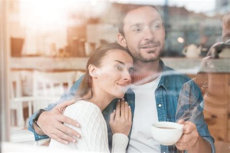 A Guy And A Girl Are Sitting Together In A Cafe Stock Photo Image Of