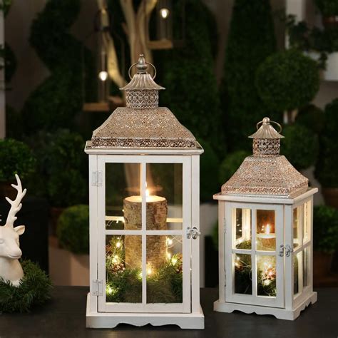 Shop pottery barn for hand crafted lanterns and candle lanterns. Urban Trends Collection White Candle Wooden Decorative ...