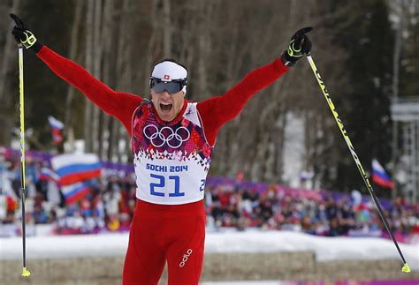 Switzerlands Cologna Celebrates As He Crosses Finish Line In Mens