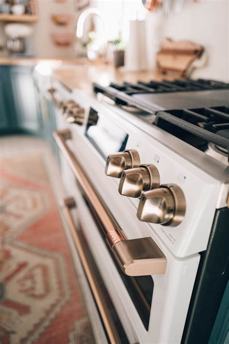 (1) see lower price in cart. Brushed Bronze Hardware on the Cafe Appliance Matte White ...