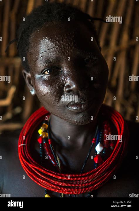 Toposa Tribe Woman With Scarified Face And Red Necklaces Omo Valley