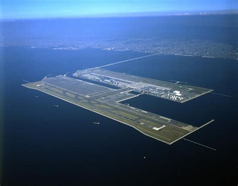 An Aerial View Of The Runway And Airport In The Middle Of The Ocean