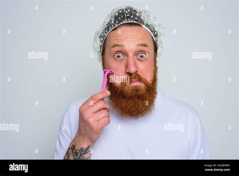 Man Adjust The Beard With A Razor Blade Stock Photo Alamy