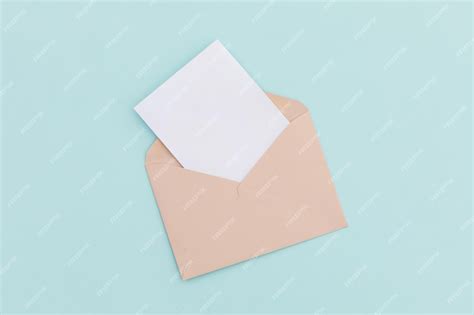 Premium Photo Opened Brown Envelope With White Letter Lying Over Pale