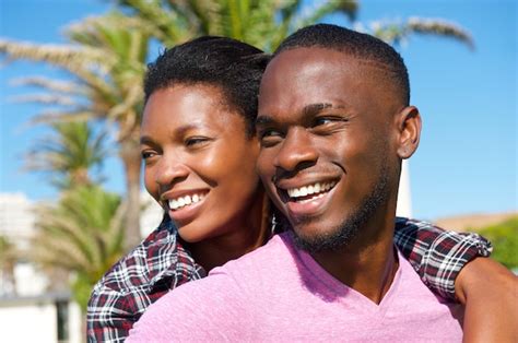 Premium Photo Cheerful Young African American Couple Smiling Outdoors