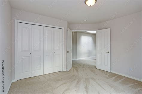 Empty Room Interior With Carpet Floor And White Walls Stock Photo