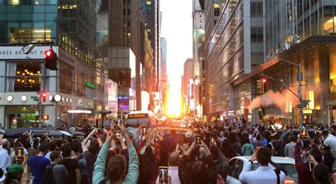 New Yorkers Gather As Manhattanhenge Illuminates City Streets The