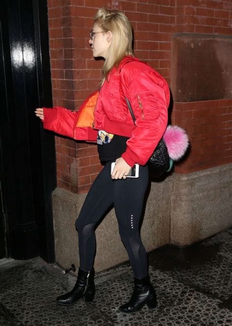 nicola peltz in tights and red jacket out in new york gotceleb