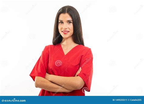 Portrait Of Beautiful Nurse Wearing Scrubs Standing With Arms Crossed