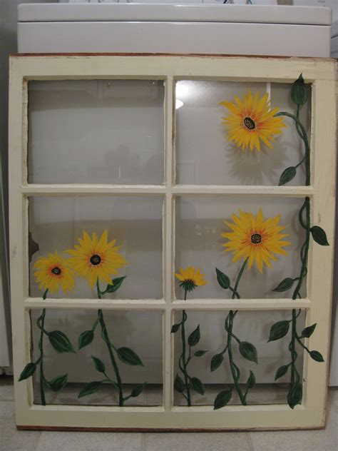 Sunflowers Are Painted On The Glass In This Window