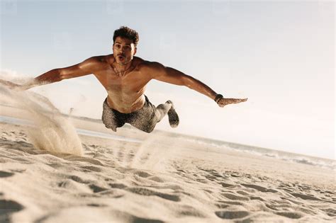 Man Doing Fitness Exercise In Beach Sand Stock Photo 149495