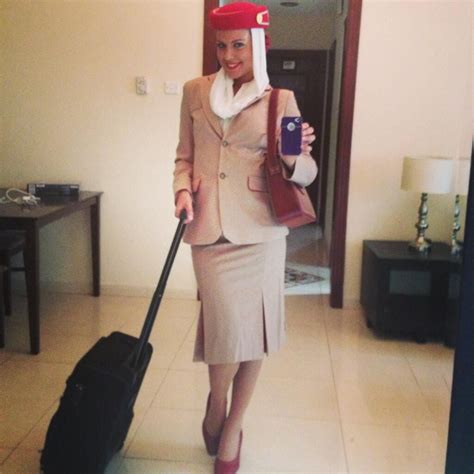 The new advertisement features an emirates cabin crew member in full uniform standing tall on the tip of. emirates cabin crew - Google Search | Air hostess uniform ...