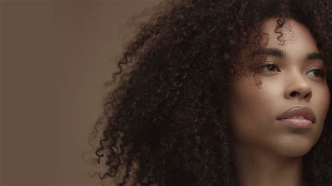 Closeup Pan Portrait Of Mixed Race Black Woman With Shiny Shealthy Skin