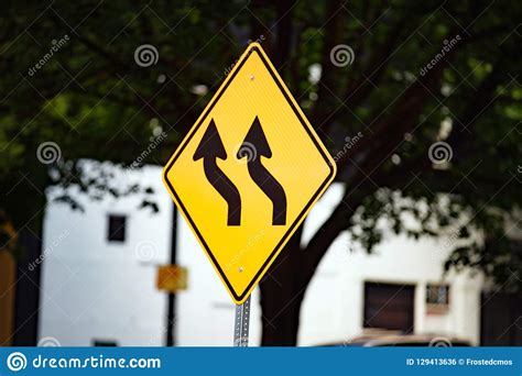 Yellow Traffic Sign With Wavy Black Arrows Stock Photo Image Of Black