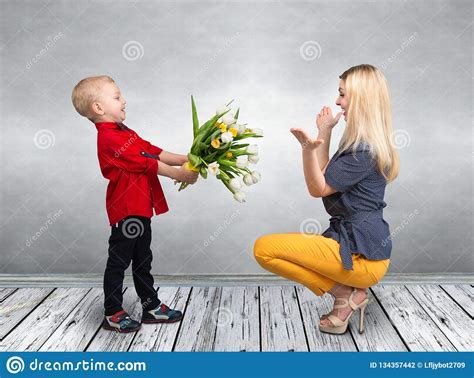 Son Gives His Beloved Mother A Bouquet Of Beautiful Tulips Spring