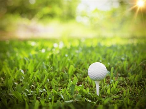 Premium Photo Golf Ball Close Up On Tee Grass On Blurred Beautiful