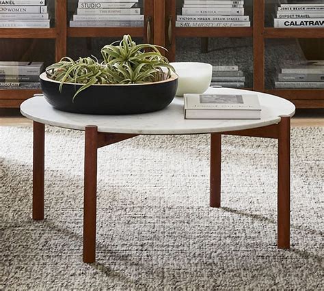 Our khaki outdoor round coffee table cover is constructed of tightly woven polyester and backed with polyvinyl chloride to protect against damage from rain and snow. Bloomquist Round Marble Coffee Table | Pottery Barn CA