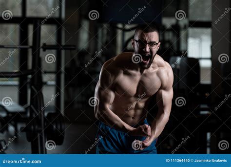 Nerd Man Standing Strong In Gym Stock Photo Image Of Caucasian