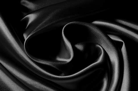 Premium Photo Detail Of A Black Wavy Silk Fabric Texture
