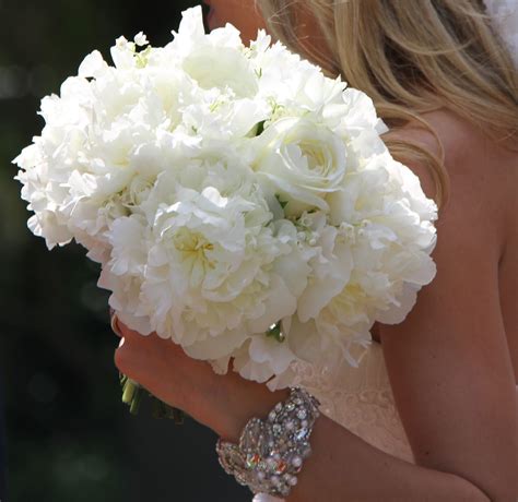 Blue flowers for a wedding that you need to consider and are easy to find are the blue hydrangea, scabiosas, muscari and delphiniums! The Flower Magician: All White Wedding Bouquet