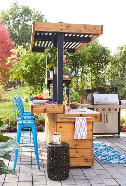 It includes a grill, maybe a pizza oven, a sink, some storage space and cooking countertops. Outdoor Bar and Grill - Contemporary - Patio - Other - by ...