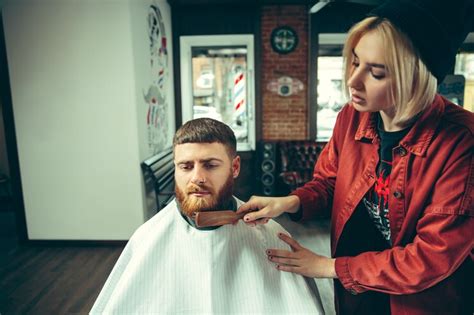 Free Photo Client During Beard Shaving In Barbershop Female Barber