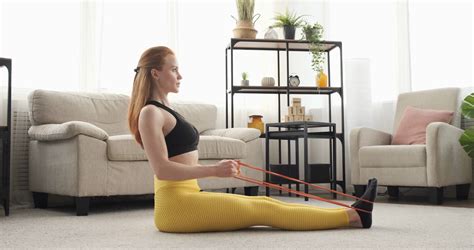 Woman Doing Seated Row Exercise With Resistance Band Stock Video
