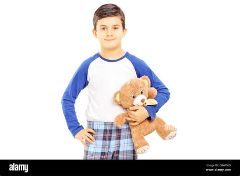 Boy In Pajamas Holding Teddy Bear Stock Photo Alamy