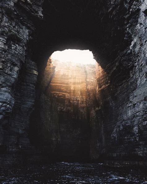 Sunlight Streaming In Cave By Sea Outdoor Adventure Tours Photo
