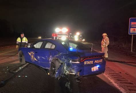 self driving tesla hits michigan state police car on freeway