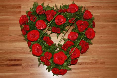 Heart Shaped Funeral Tribute Of Red Roses And Carnations Funeral