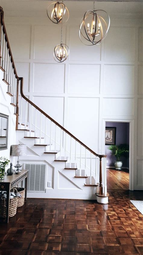 Installing wainscoting on the ceiling can transform the look of the entire room by adding dimension and depth to the space. Kensington Lake Foyer featuring Progress Lighting Equinox ...