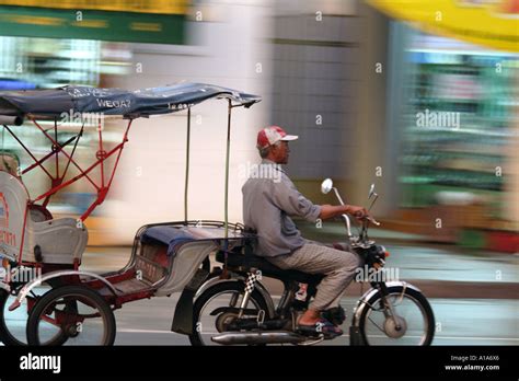 Man Pulling A Cart For Transporting People With His Motorbike In Vihn