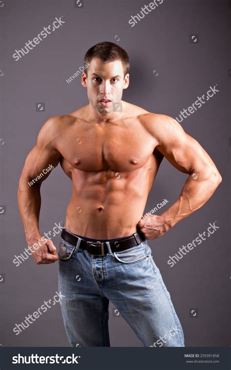 Young Muscular Man Flexing His Muscles Stock Photo 259391858 Shutterstock