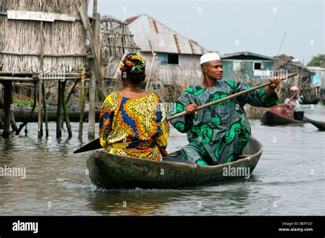 Tofinu Man And Woman In Canoe At Ganvie Largest Lake Village In Africa