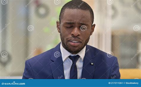 Portrait Of Upset African Businessman Crying At Camera Stock Image