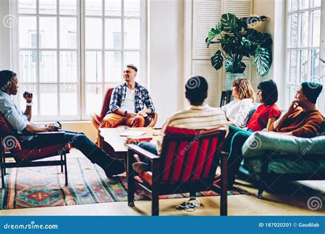 Diverse Friends Gathering In Spacious Living Room Stock Image Image